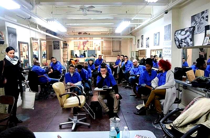 ABI graduates and instructors together on the barber clinic floor in New York City