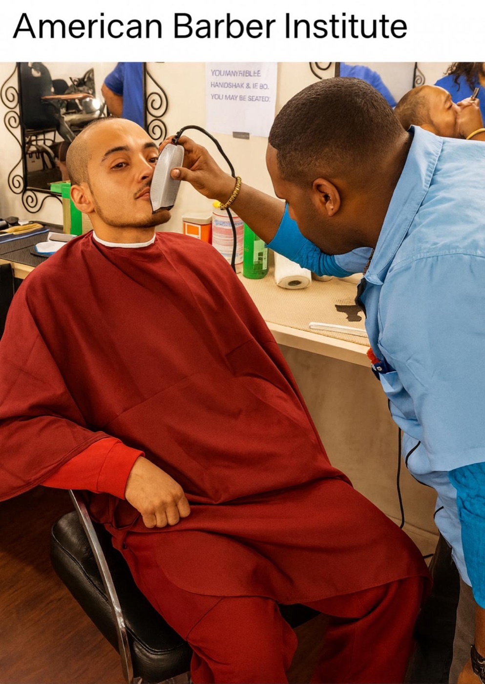 Student shaving a client's face